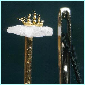 Gold-ship-micro-sculpture-by-Willard-Wigan